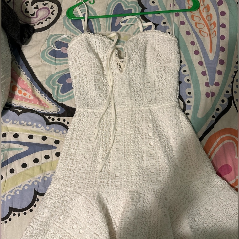 Super down white dress with open back.